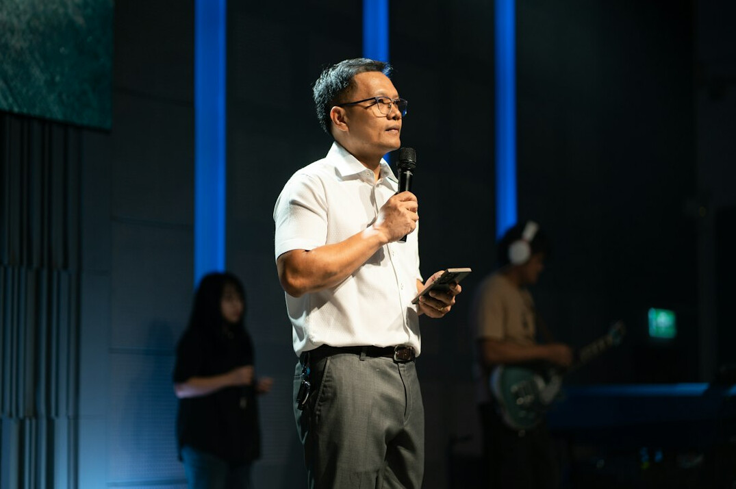 Businessman speaking at a podium during a forum event