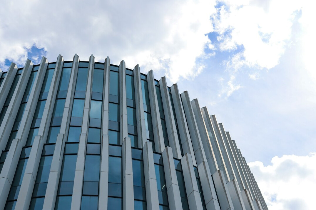Exterior of a modern office building with glass facade in Brussels
